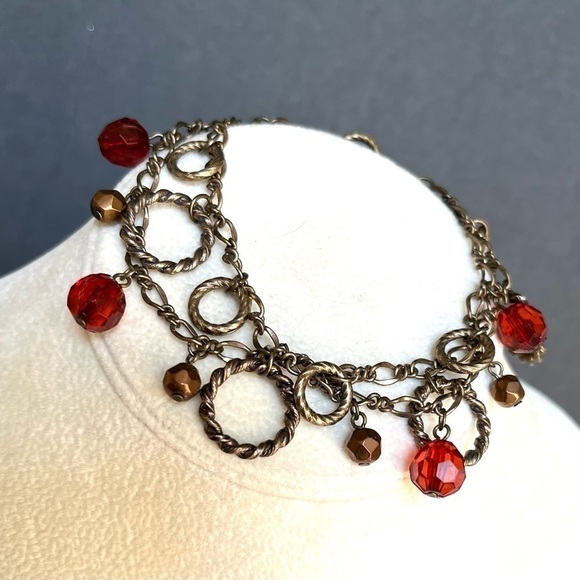 Antiqued brass finish two strand circle red/copper faceted bead charm bracelet. - Picture 4 of 4